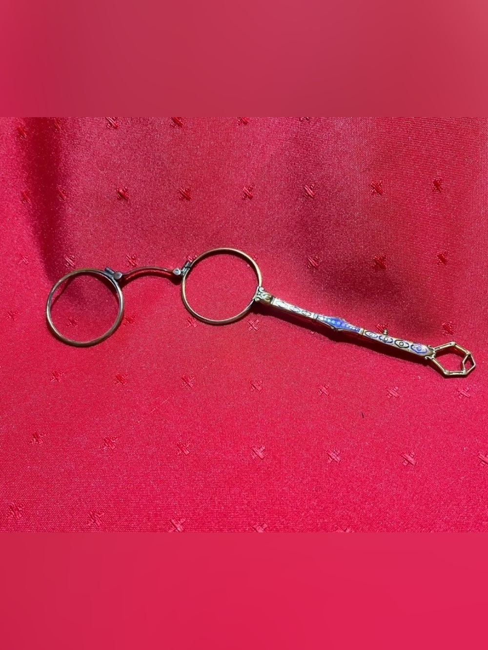 antique lorgnette, a type of spectacles with a handle.